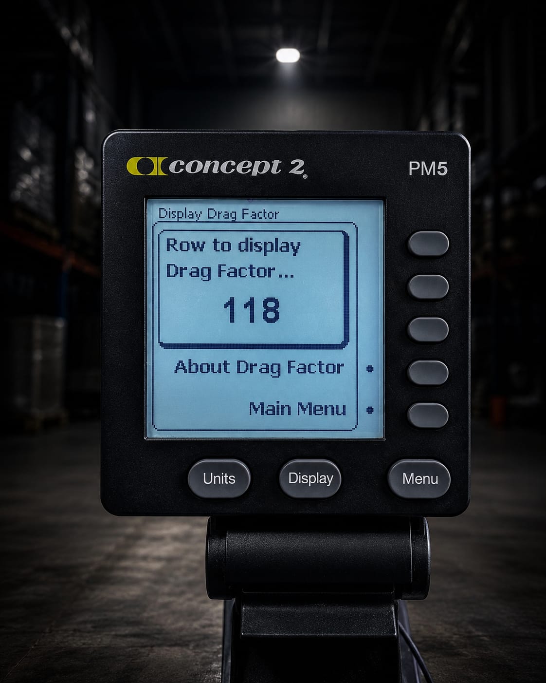 A Concept2 PM5 monitor displaying a drag factor of 118, right in the recommended window