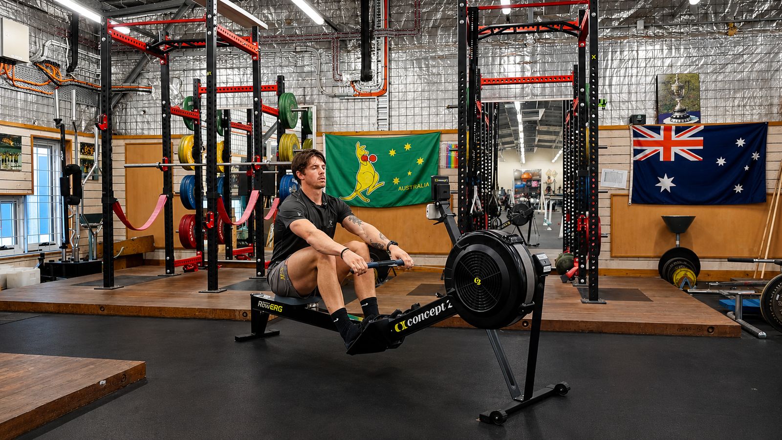 Angus Dawson mid-drive on a Concept2 RowErg in the Australian team gym